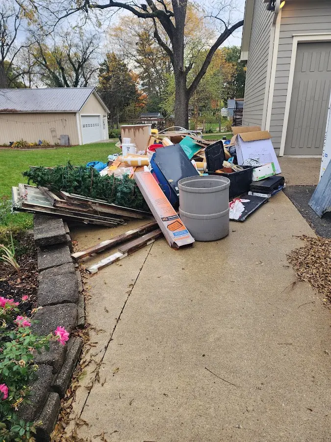 Dumpster being loaded with debris for Roofing Dumpster Rental in Park City
